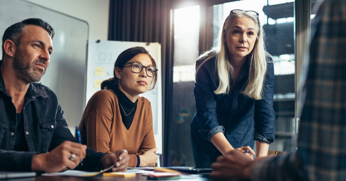 A team listening attentively to a leader or speaker.